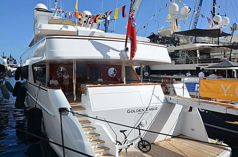 a boat with flags on it aboard NATALIA V Yacht for Sale