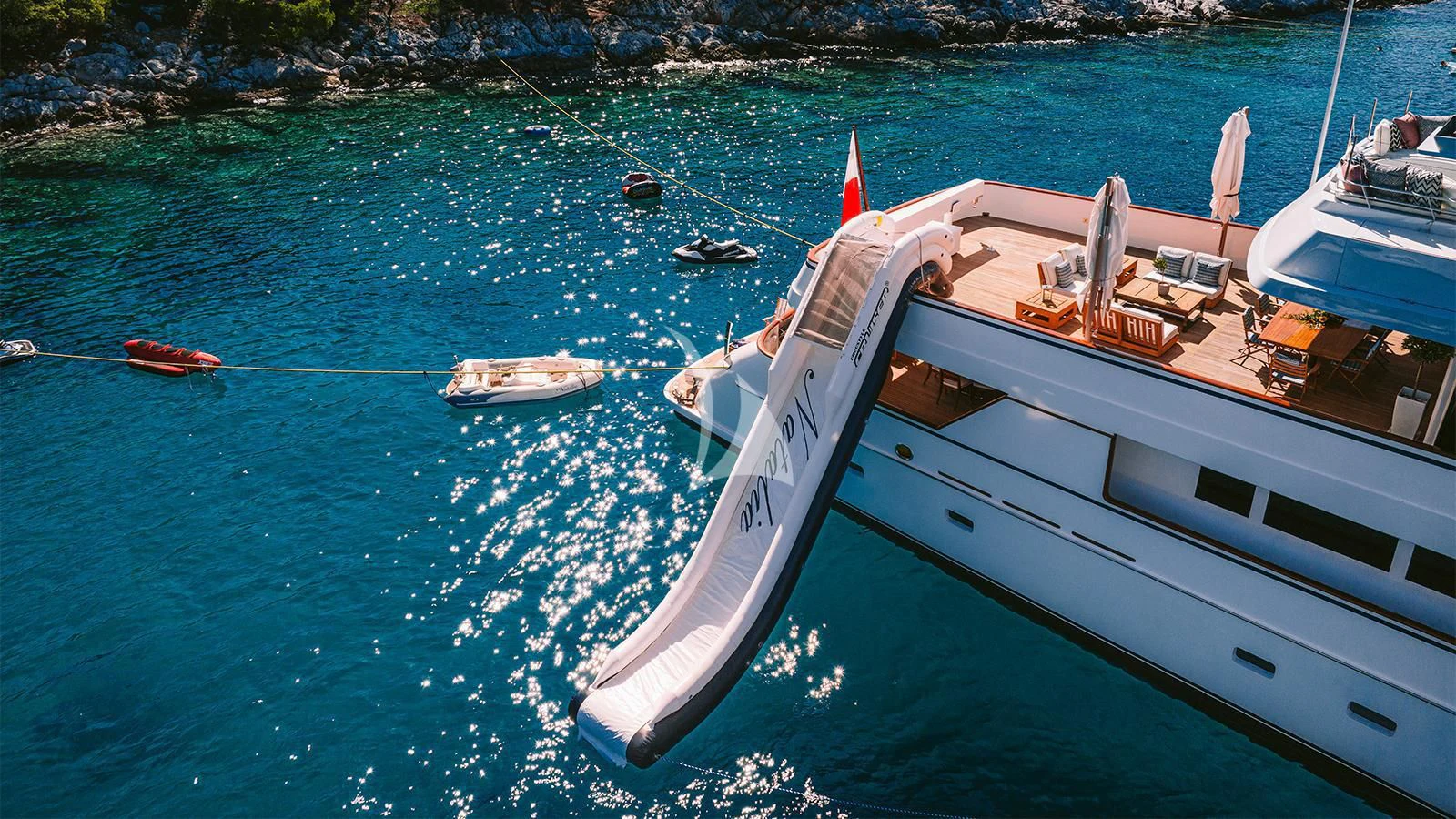 a boat tied to a dock aboard NATALIA V Yacht for Sale