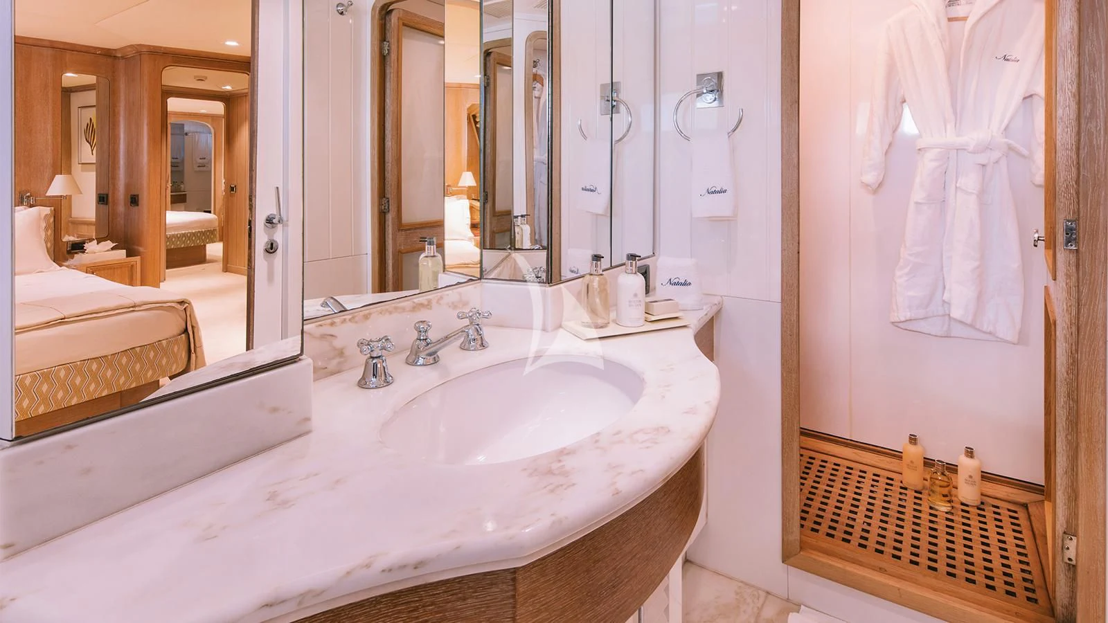 a bathroom with a sink and a mirror aboard NATALIA V Yacht for Sale