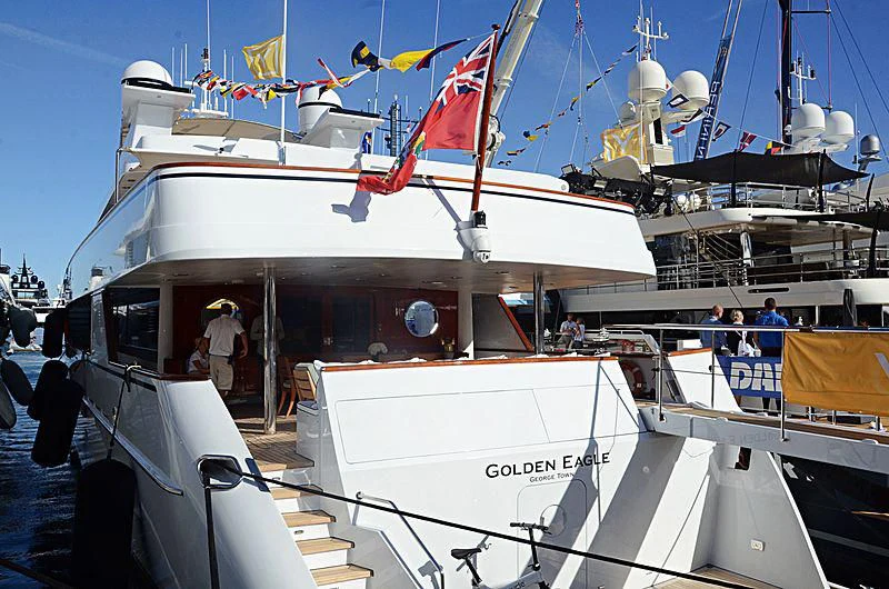 a boat with flags on it aboard NATALIA V Yacht for Sale