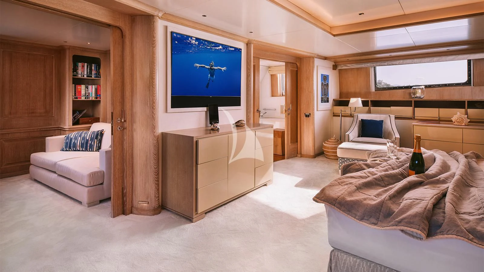 a room with a tv and a bed aboard NATALIA V Yacht for Sale