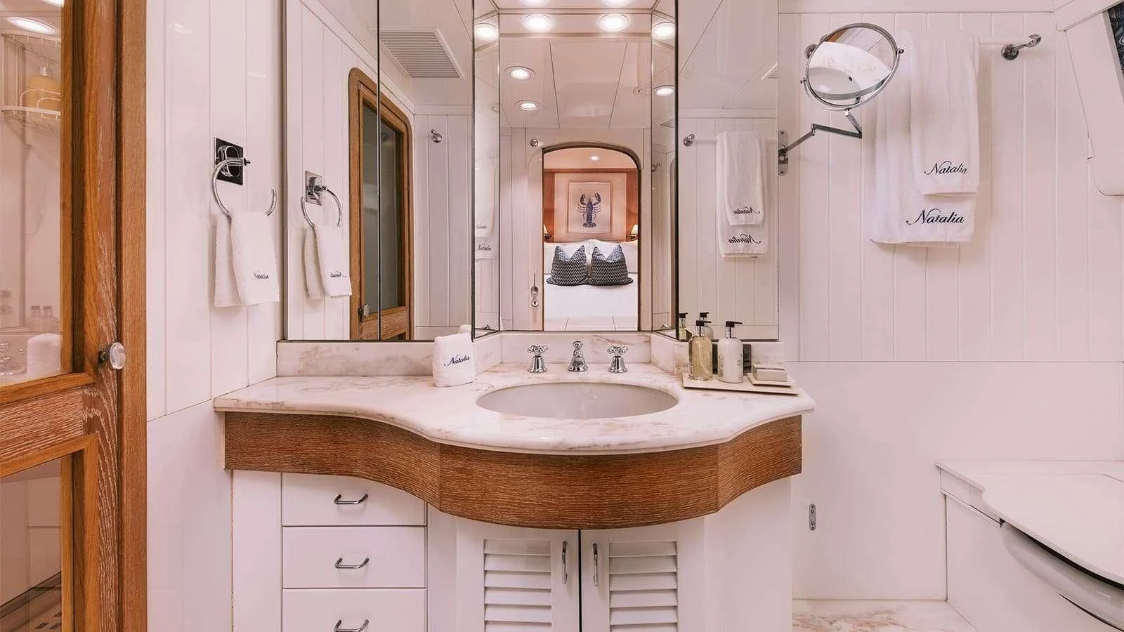 a bathroom with a sink and a mirror aboard NATALIA V Yacht for Sale
