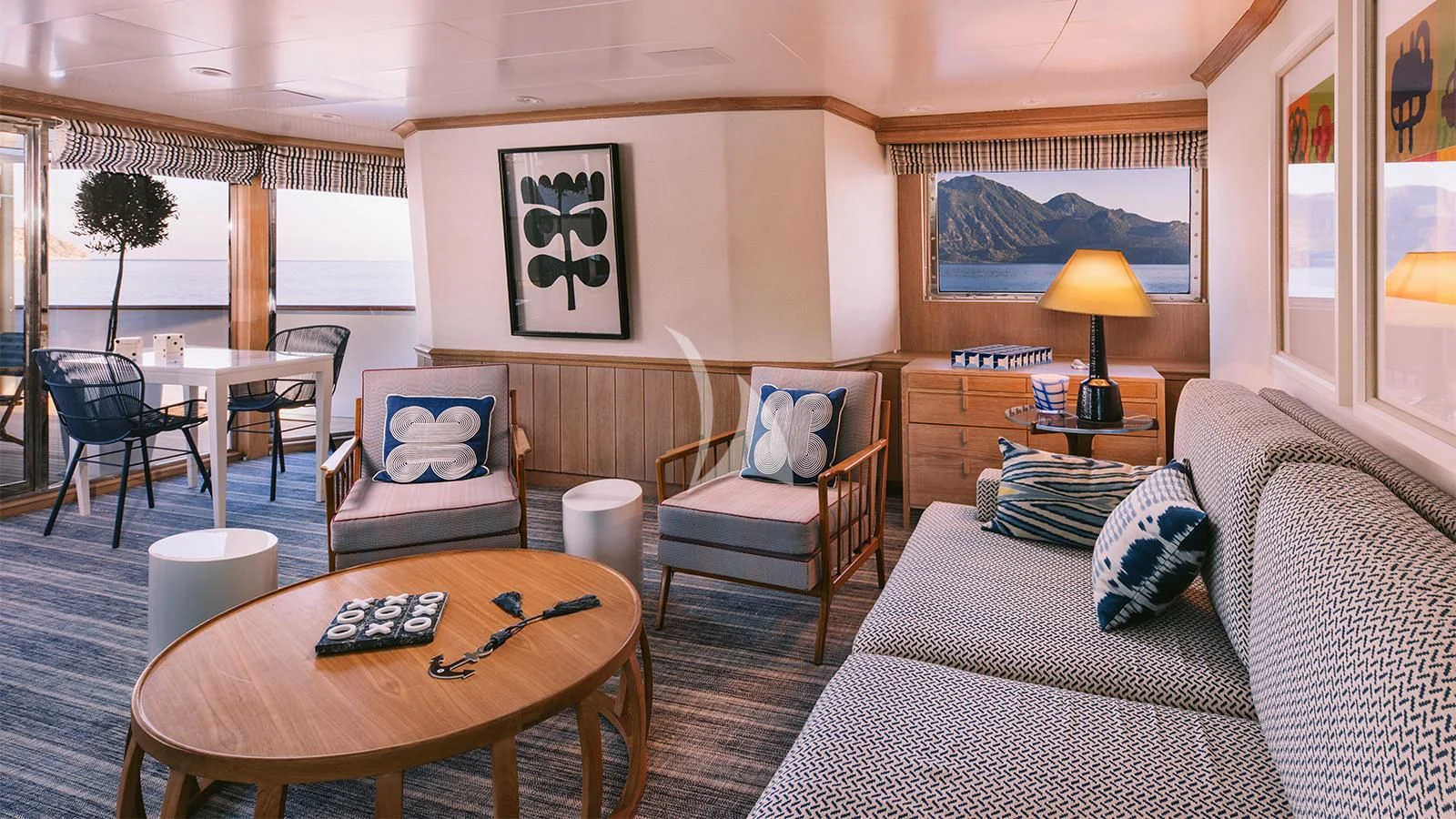 a living room with a couch and a coffee table aboard NATALIA V Yacht for Sale