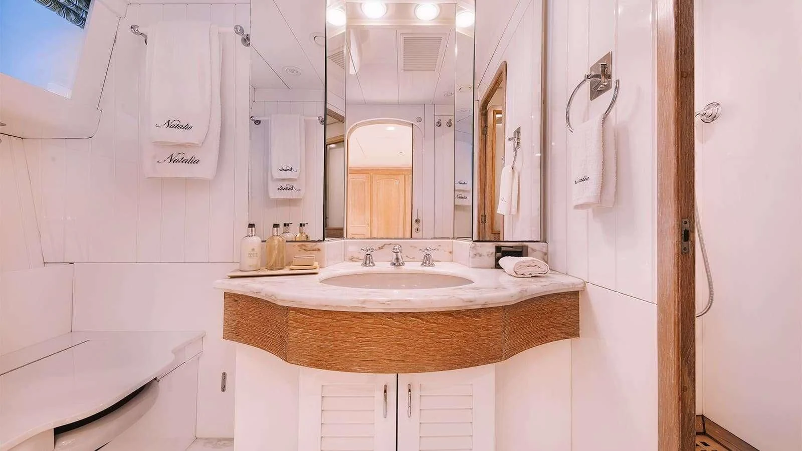 a bathroom with a sink and a mirror aboard NATALIA V Yacht for Sale
