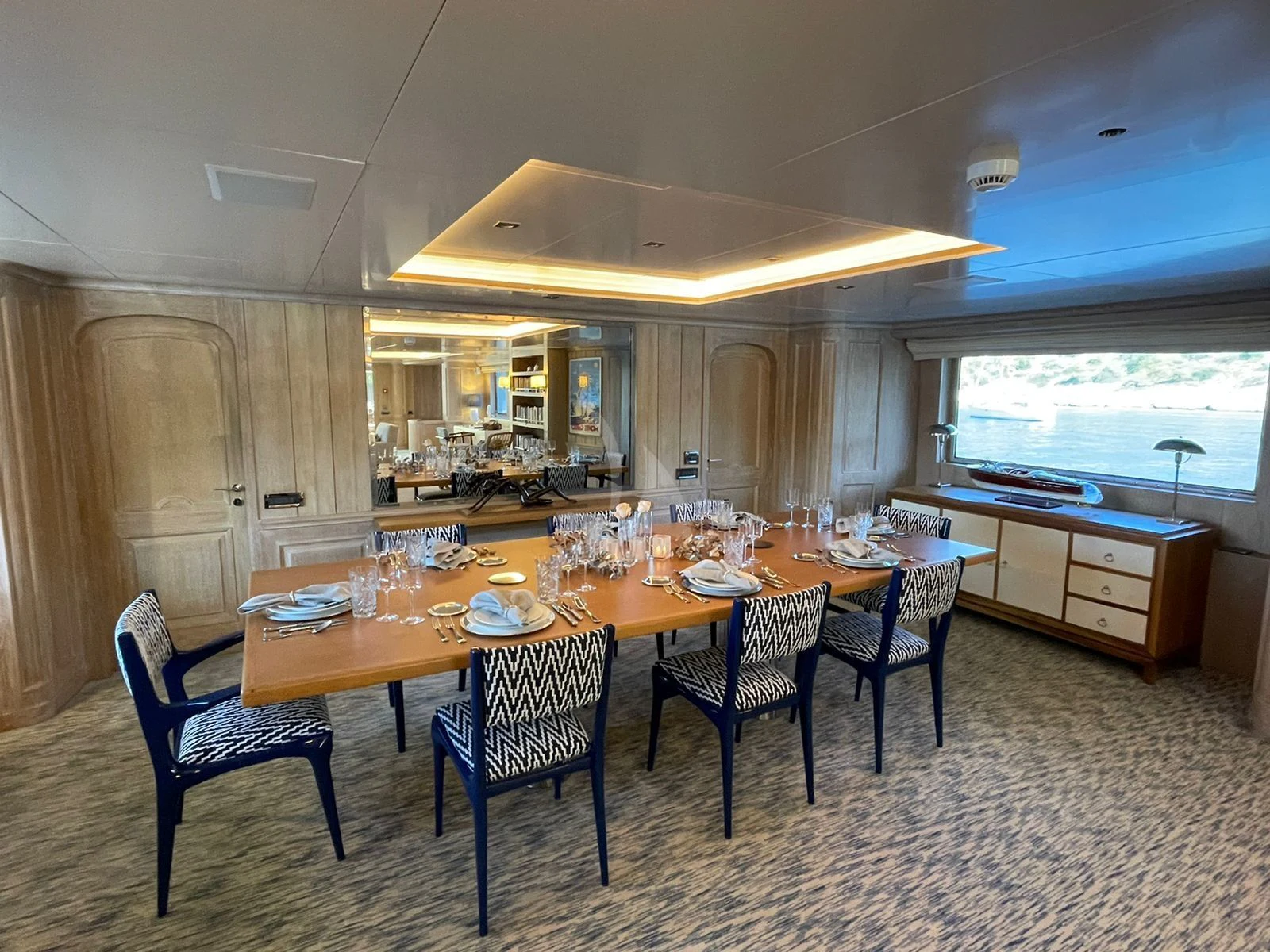 a kitchen with a dining table aboard NATALIA V Yacht for Sale