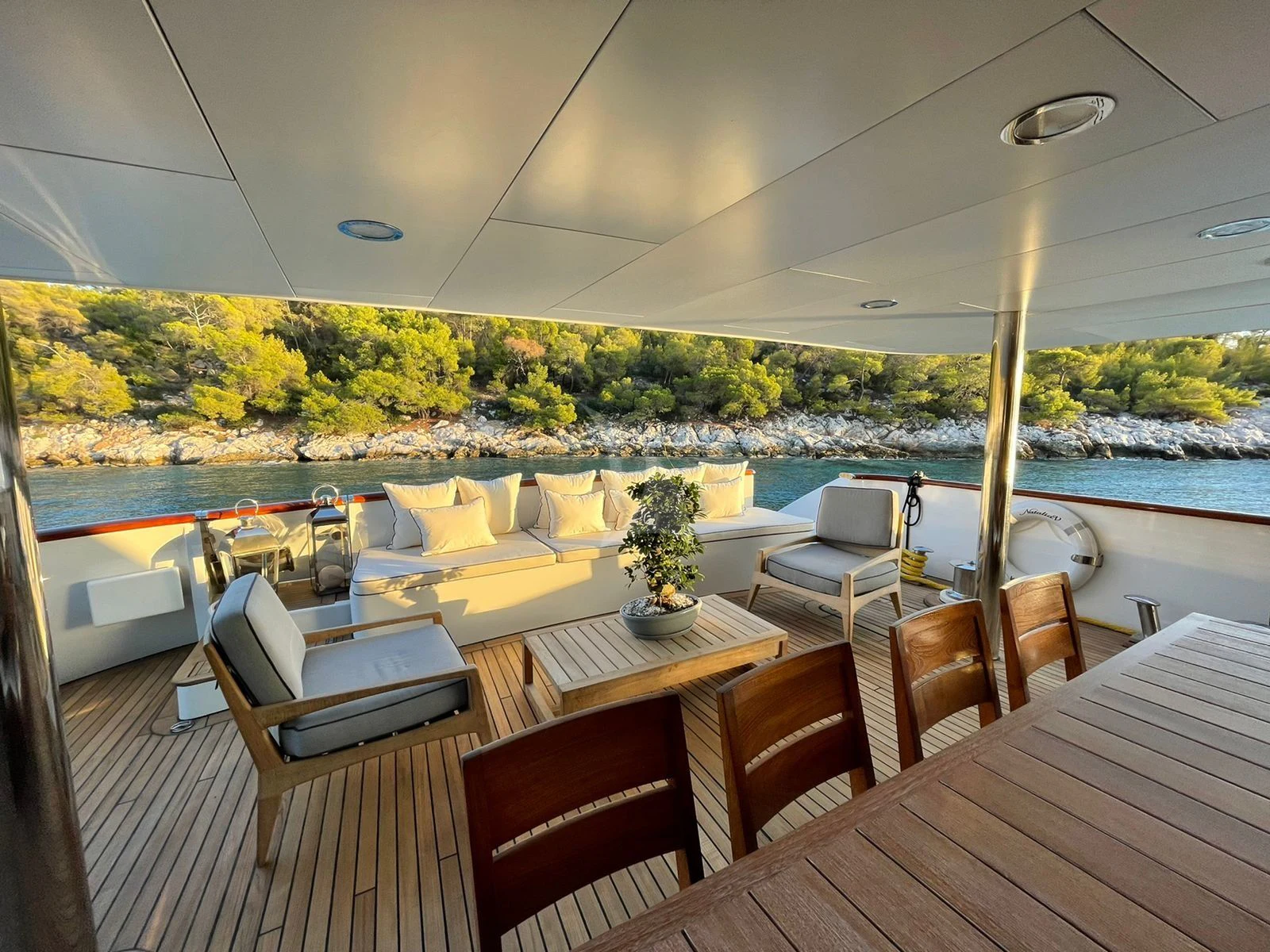 a room with tables and chairs aboard NATALIA V Yacht for Sale