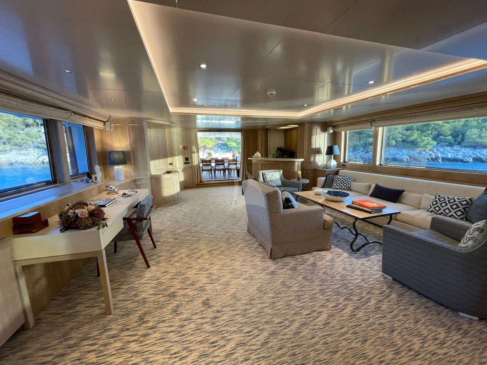 a living room with a large window aboard NATALIA V Yacht for Sale