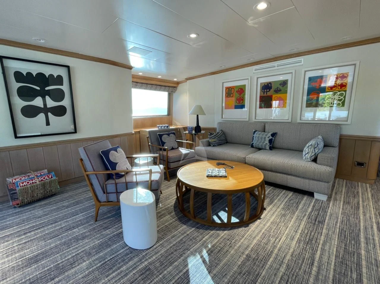a living room with a couch and a coffee table aboard NATALIA V Yacht for Sale