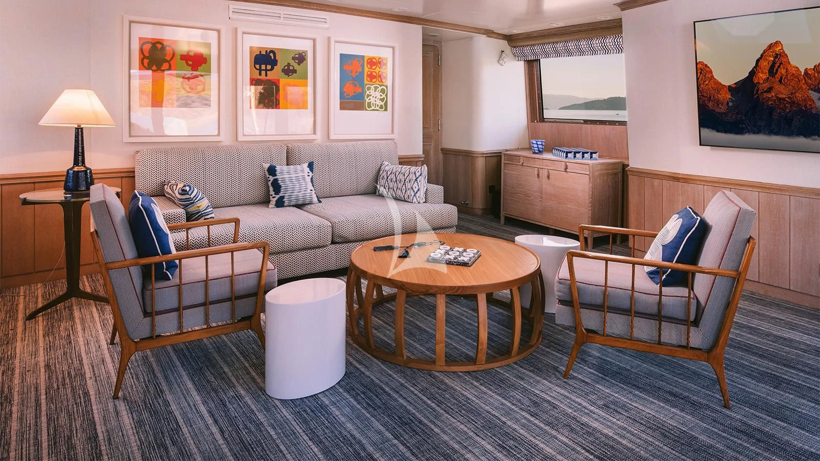 a living room with a couch and a coffee table aboard NATALIA V Yacht for Sale