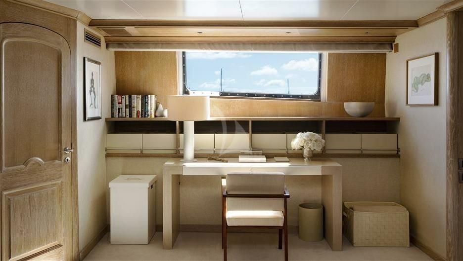 a room with a desk and a tv aboard NATALIA V Yacht for Sale