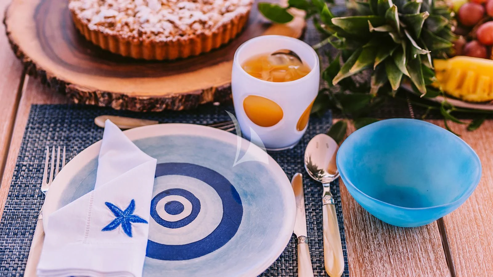 a plate of food and a cup of tea on a table aboard NATALIA V Yacht for Sale