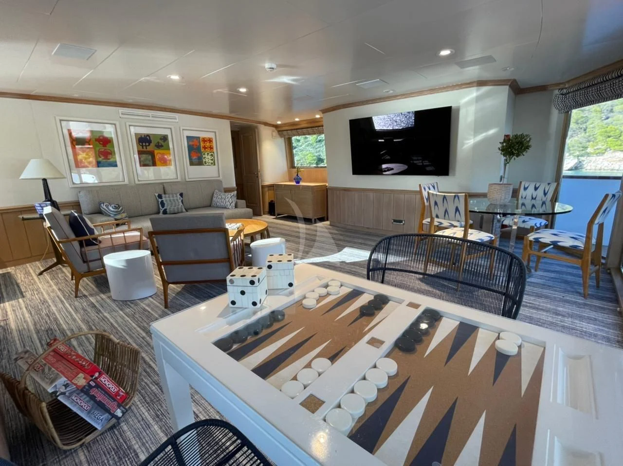 a living room with a large screen aboard NATALIA V Yacht for Sale