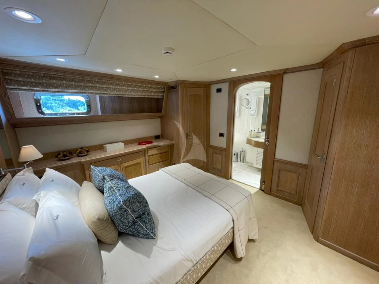 a room with a bed and a desk aboard NATALIA V Yacht for Sale