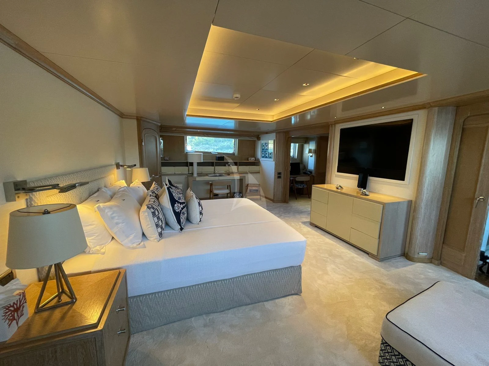 a hotel room with a bed and a tv aboard NATALIA V Yacht for Sale