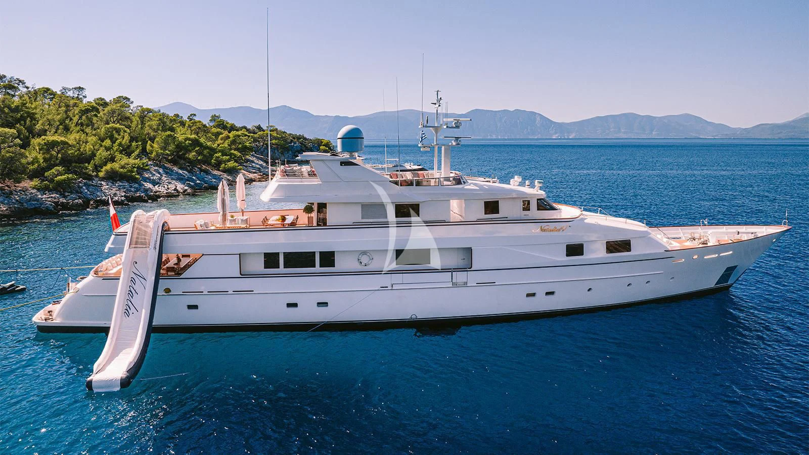 a white boat in the water aboard NATALIA V Yacht for Sale