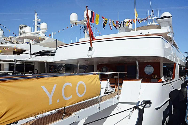a boat with flags on it aboard NATALIA V Yacht for Sale
