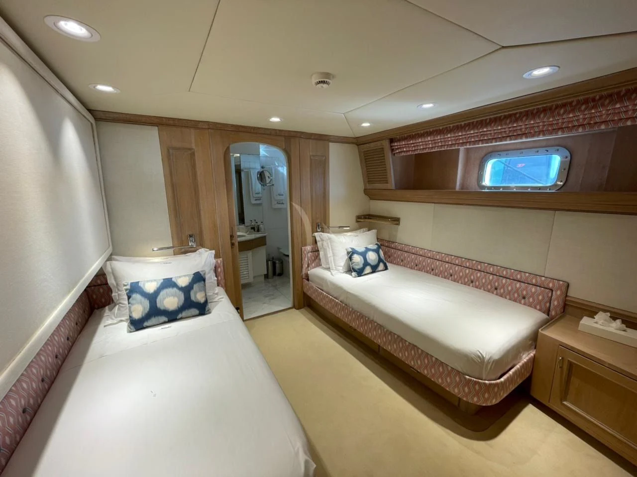 a room with a couple of beds aboard NATALIA V Yacht for Sale