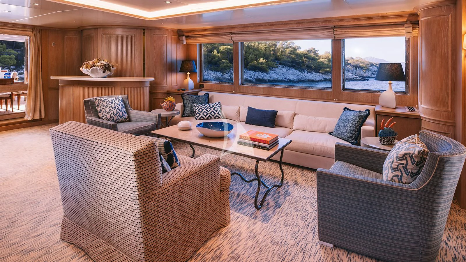 a living room with a couch and a table aboard NATALIA V Yacht for Sale