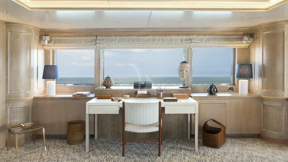 a room with a table and chairs aboard NATALIA V Yacht for Sale