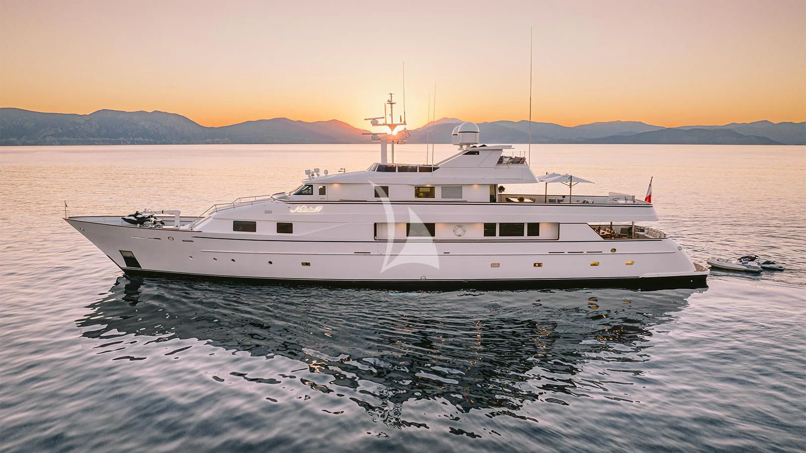 a large white yacht in the water aboard NATALIA V Yacht for Sale