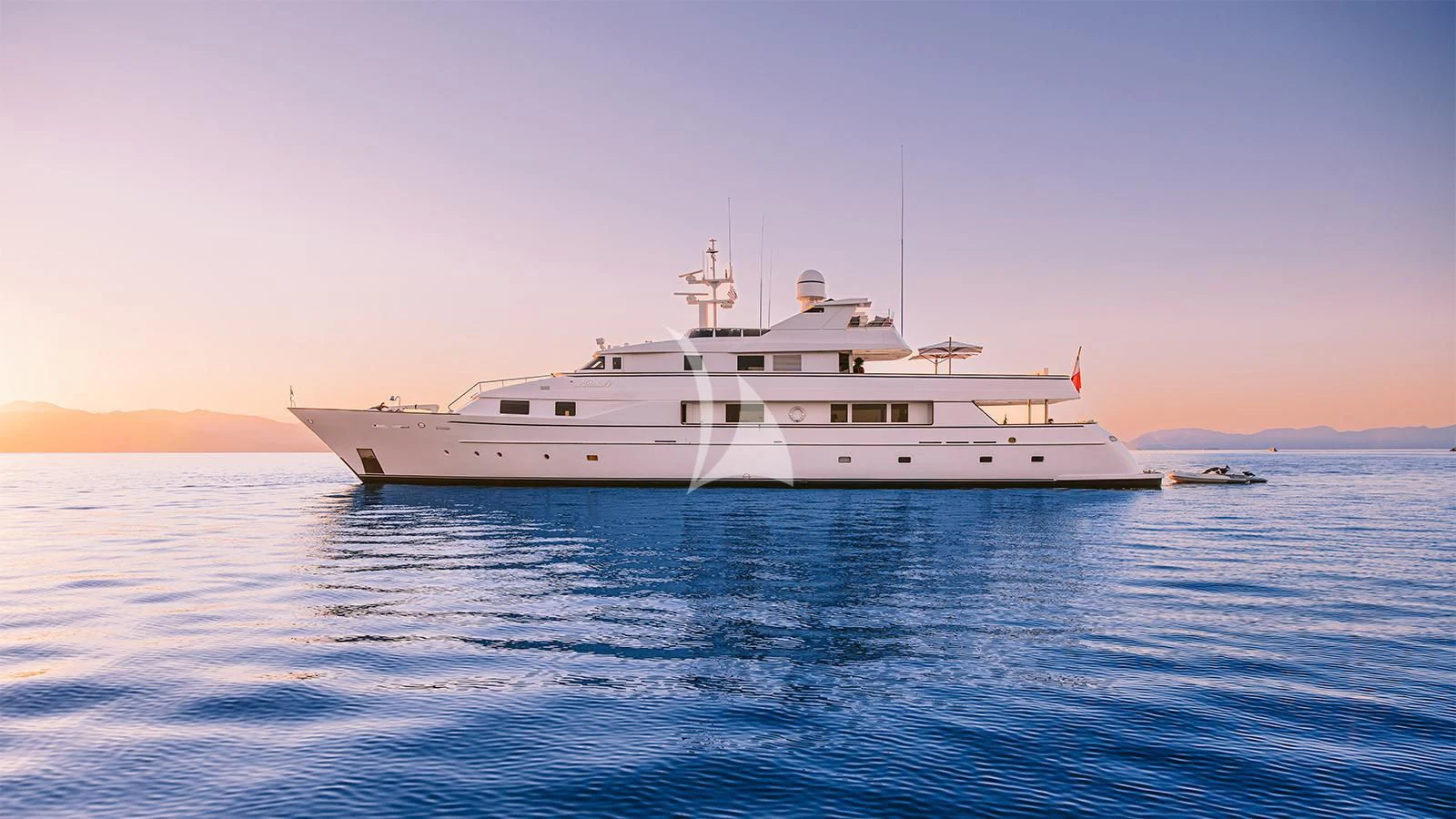 a white boat in the water aboard NATALIA V Yacht for Sale