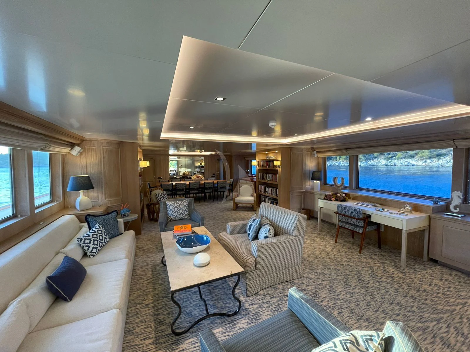a living room with a large window aboard NATALIA V Yacht for Sale