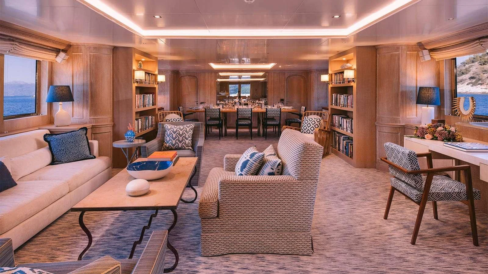 a living room with a couch and a coffee table aboard NATALIA V Yacht for Sale