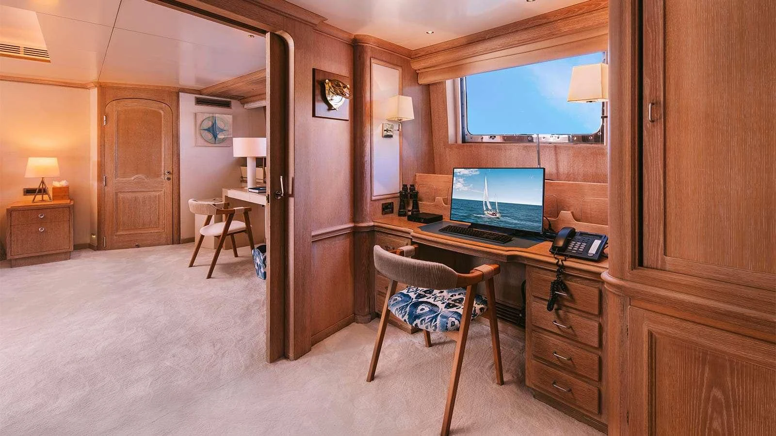a room with a desk and a computer aboard NATALIA V Yacht for Sale