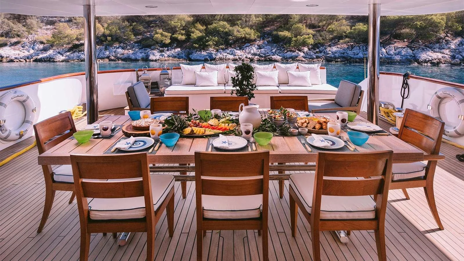 a table set for a meal aboard NATALIA V Yacht for Sale
