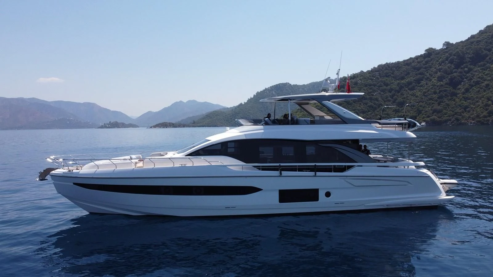 a white yacht on the water aboard ANANDA Yacht for Sale