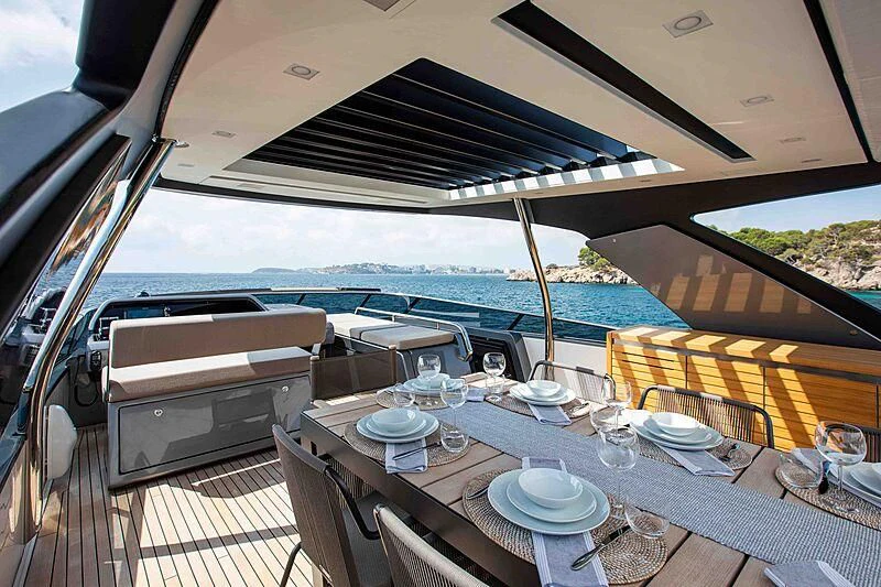 a table with plates and glasses on it aboard BALANCE Yacht for Sale