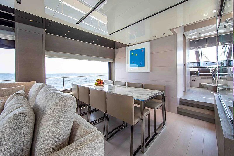 a room with a table and chairs aboard BALANCE Yacht for Sale