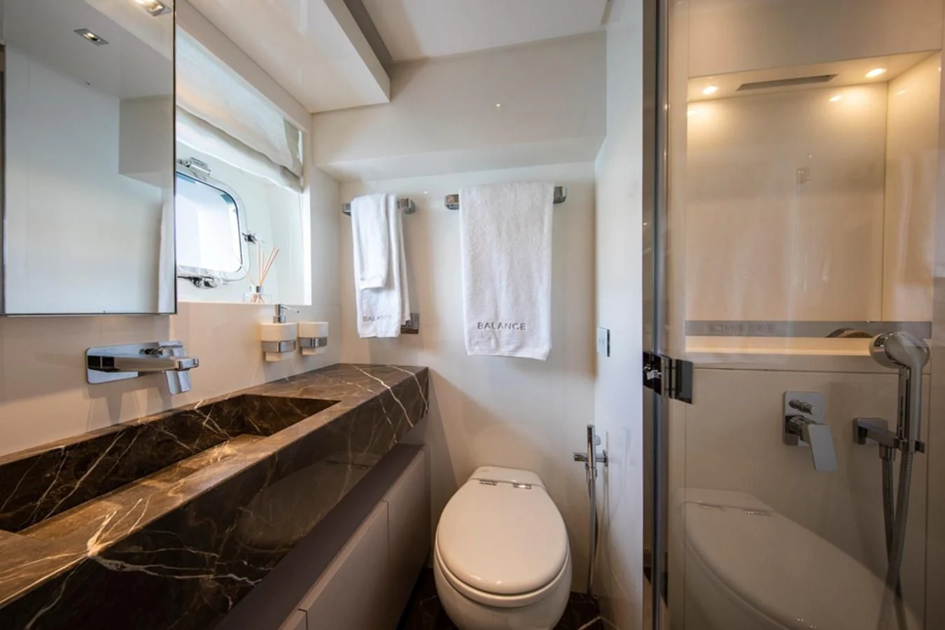 a bathroom with a tub and toilet aboard BALANCE Yacht for Sale