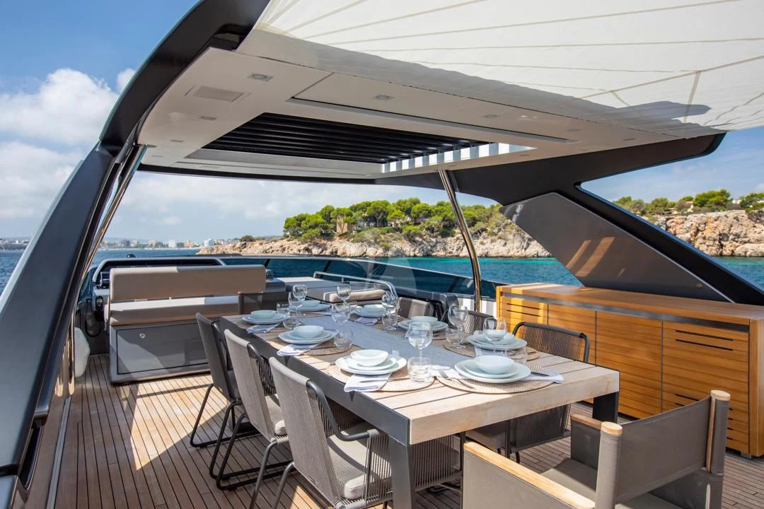 a table with plates and glasses on it aboard BALANCE Yacht for Sale