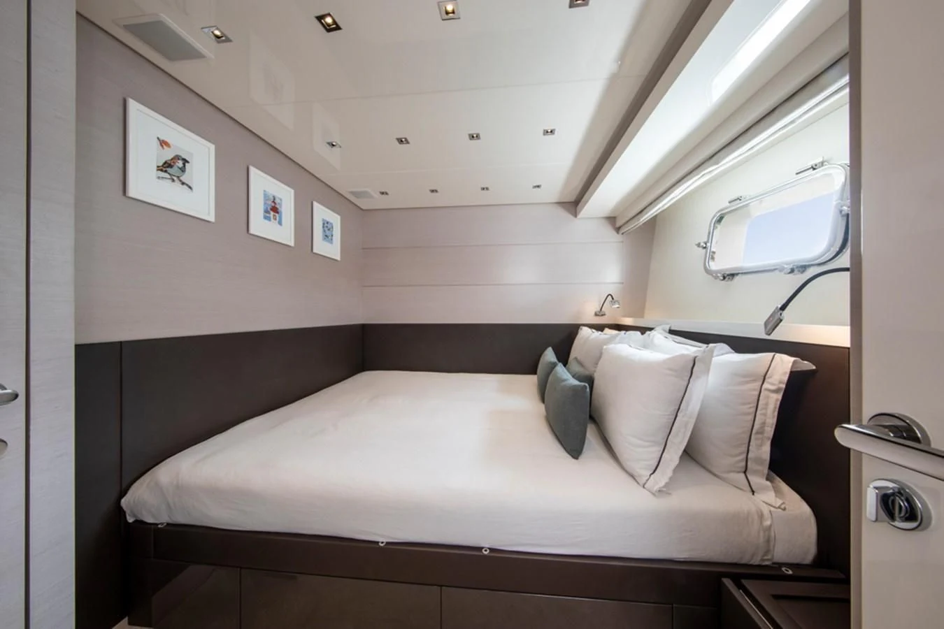 a bed with a white bed aboard BALANCE Yacht for Sale