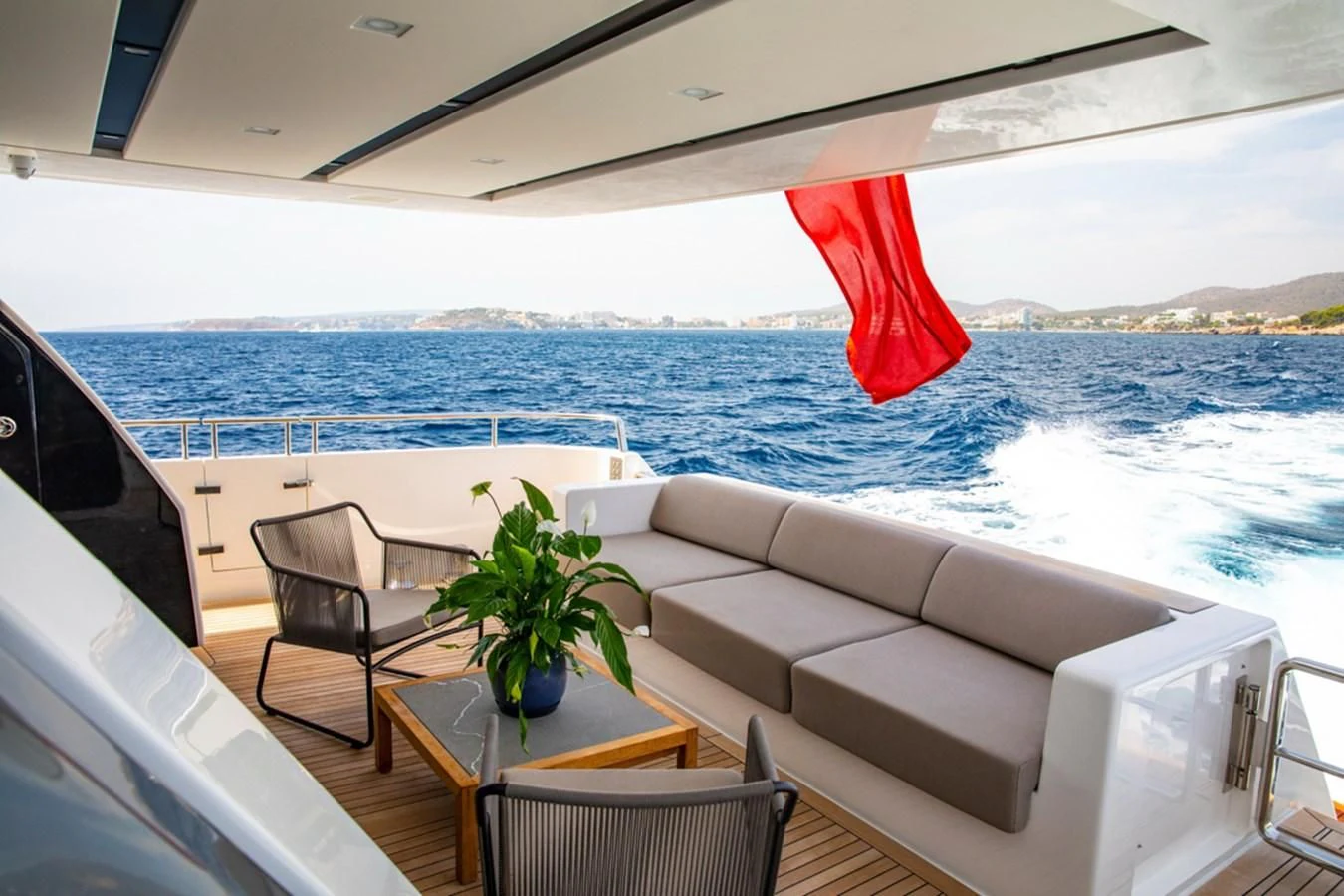 a white couch and a table on a boat aboard BALANCE Yacht for Sale