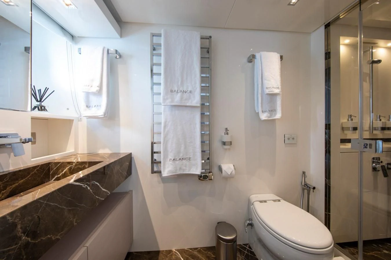 a bathroom with a tub sink and toilet aboard BALANCE Yacht for Sale