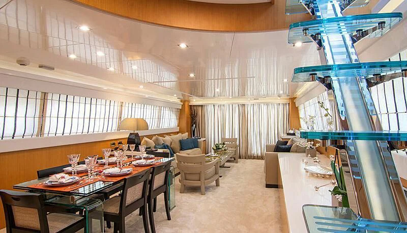 a large room with a table and chairs aboard HABANO Yacht for Sale