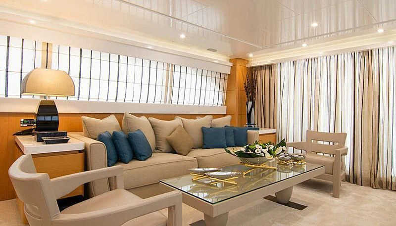 a living room with a couch and a table aboard HABANO Yacht for Sale