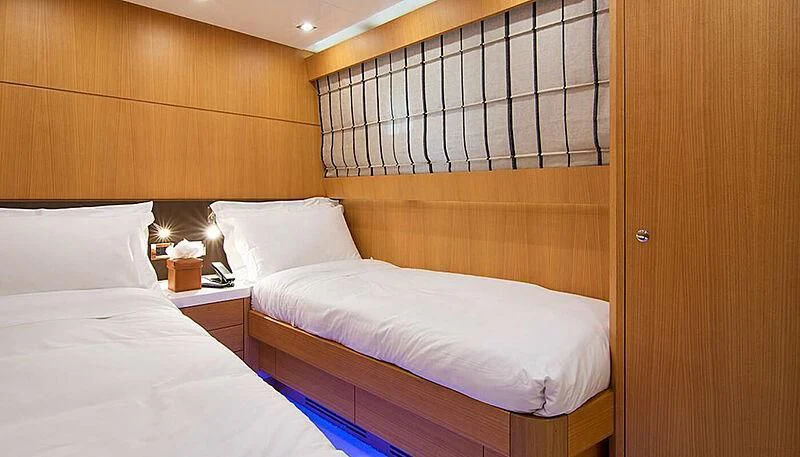a room with two beds aboard HABANO Yacht for Sale