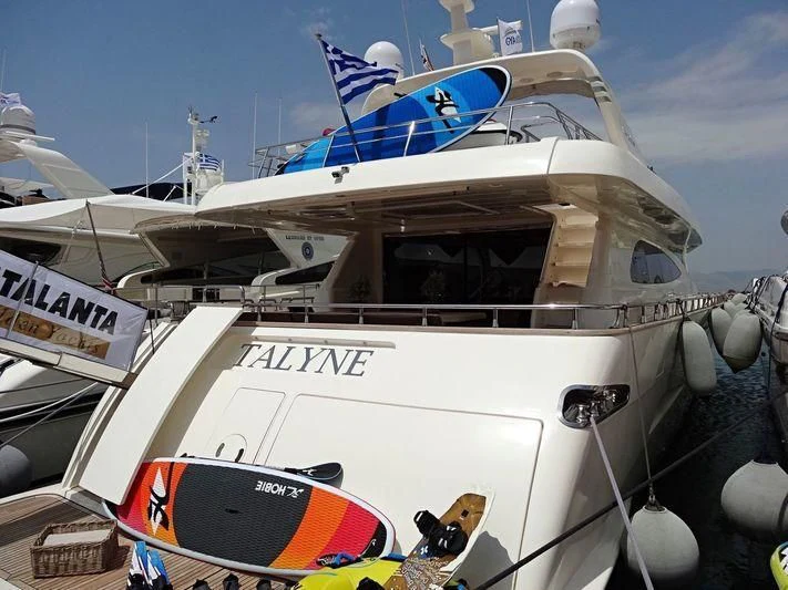 a boat with a flag on the front aboard HABANO Yacht for Sale