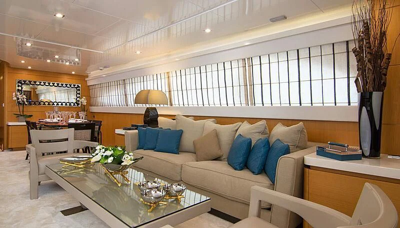 a living room with a couch and a table aboard HABANO Yacht for Sale