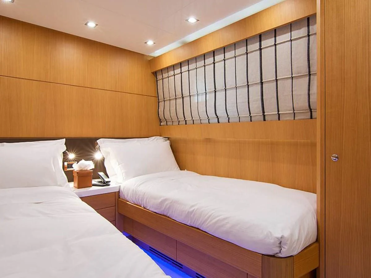 a room with two beds aboard HABANO Yacht for Sale