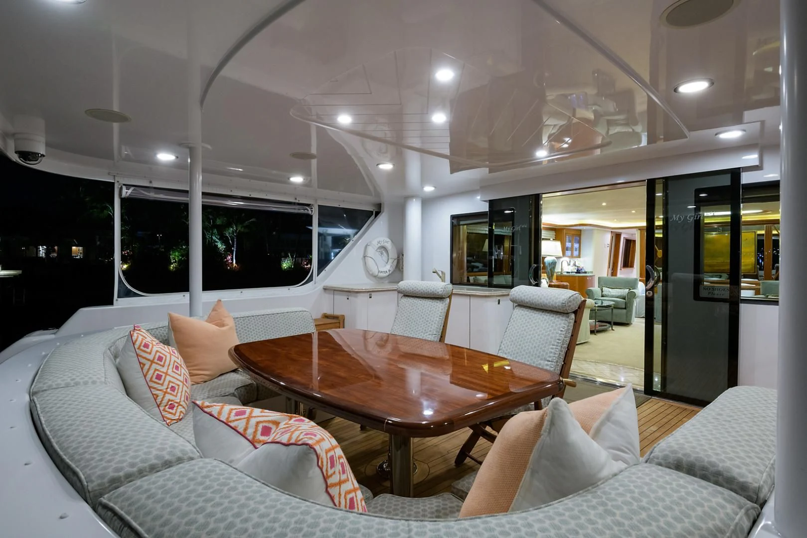 a living room with a table and couches aboard MY GIRL Yacht for Sale