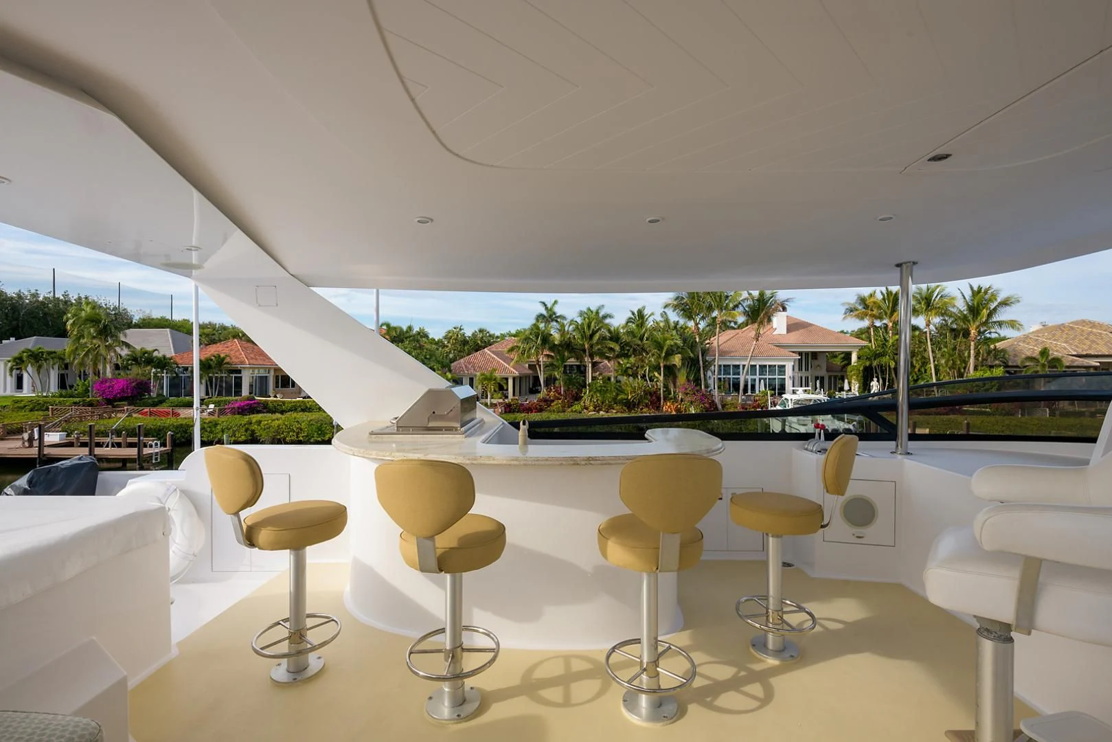 a room with stools and tables aboard MY GIRL Yacht for Sale