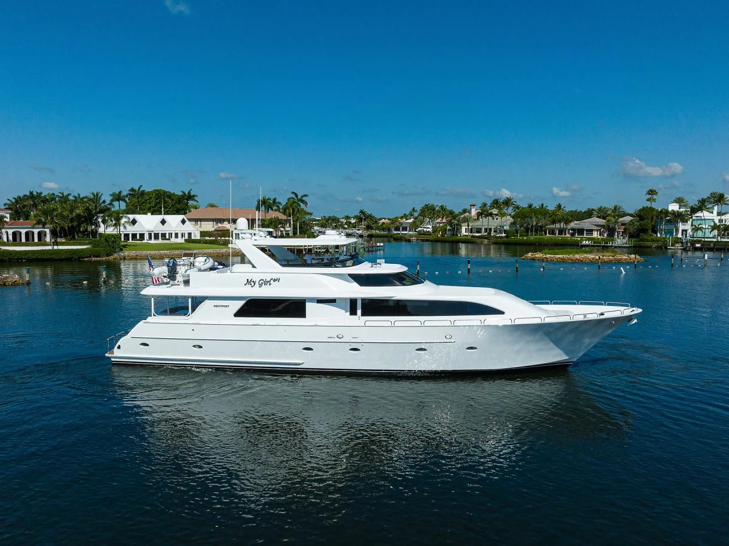 a white boat in a body of water aboard MY GIRL Yacht for Sale