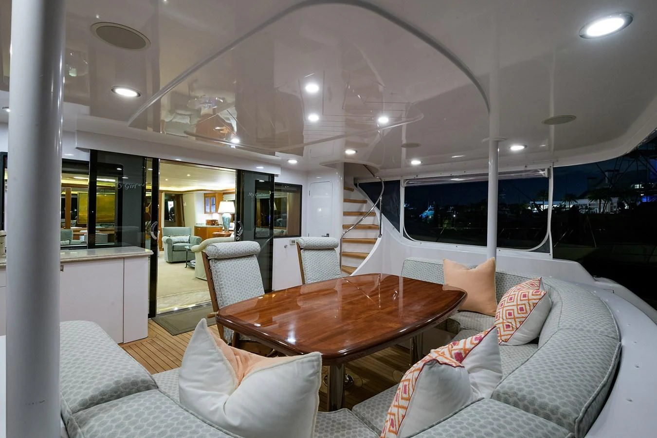 a living room with a table and chairs aboard MY GIRL Yacht for Sale