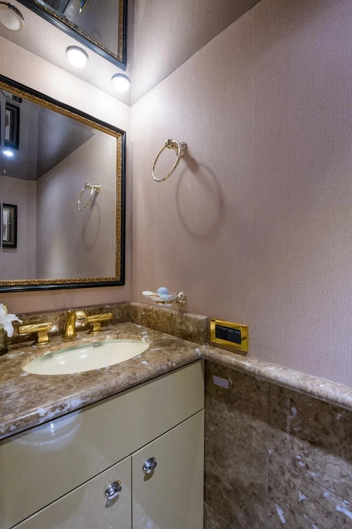 a bathroom with a sink and a mirror aboard MY GIRL Yacht for Sale