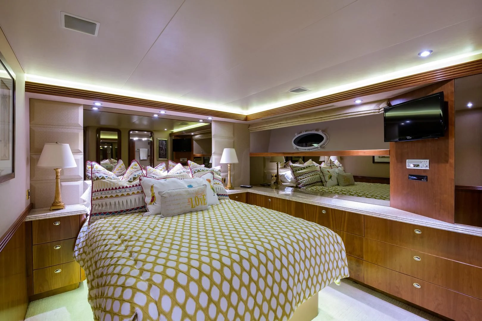 a room with a bed and a television aboard MY GIRL Yacht for Sale