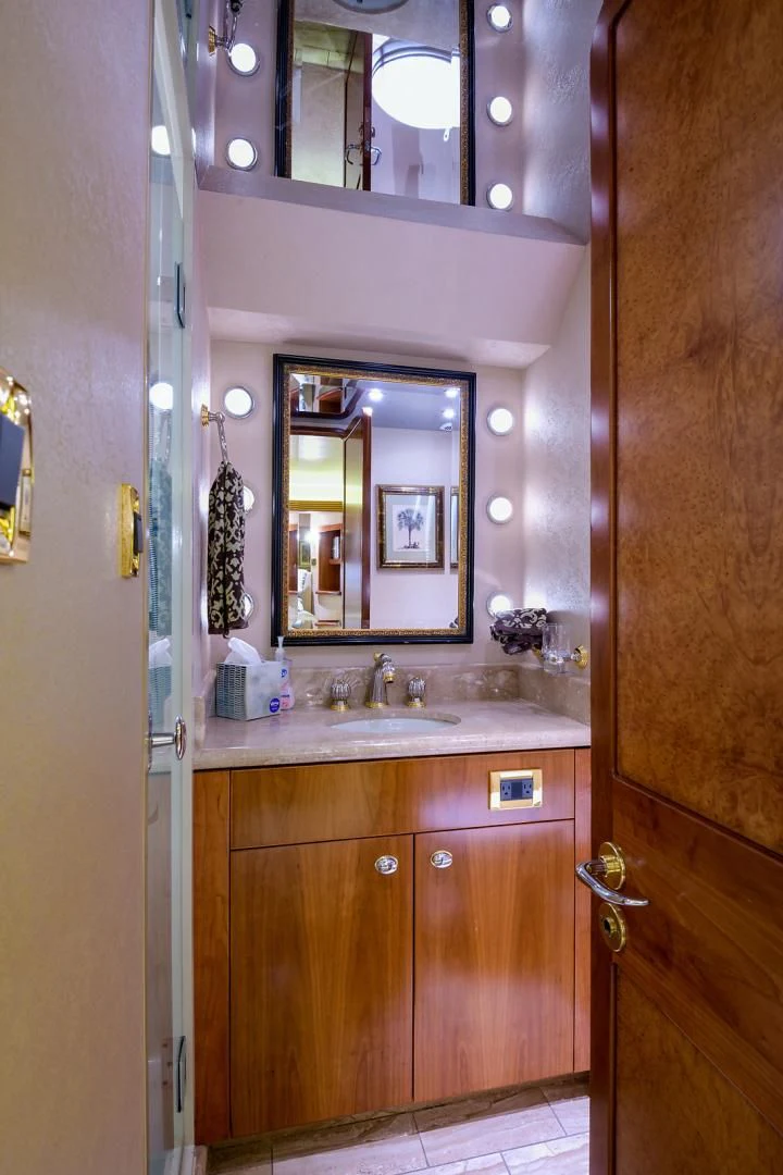 a bathroom with a mirror and sink aboard MY GIRL Yacht for Sale